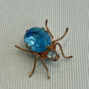 A Spider Pin Brooch With A Turquoise Stone