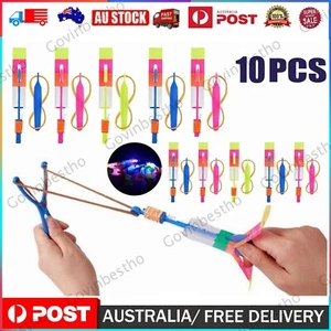 10Pcs Flying Rotating Rocket Helicopter LED Light Toy Elastic Sling Night Fliers - Picture 1 of 11