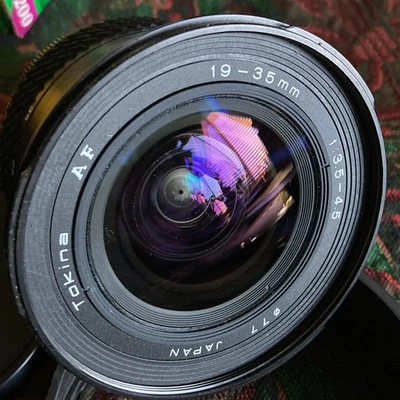 Tokina for Nikon 19-35mm Zoom Lens with Caps and Hood, Beautiful Coating. SMOOTH - Image 1 of 4