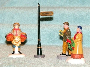 Dept.56 & Lemax - "Christmas Apple Vendor & Shoppers" (3 Figures + Street Sign) - Picture 1 of 8