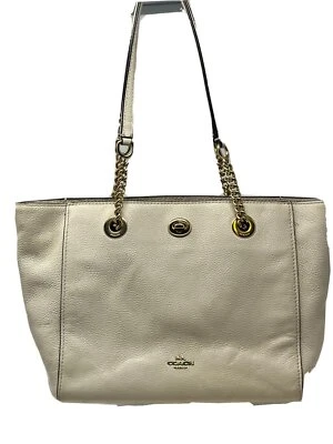 Bolso de mano Coach para mujer con cadena Turnlock de guijarros Foto 1 de 4