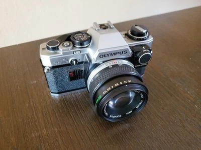 Olympus OM-10 Silver 35mm SLR Film Camera With Olympus Zuiko 50mm F/1.8 Lens - Image 1 of 4