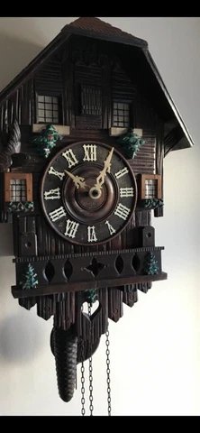 Antique large black Forrest cuckoo clock Cover