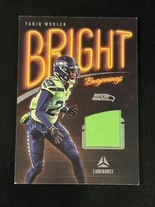  2023 Panini Luminance Tariq Woolen Bright Beginnings Jersey NEON,  SEAHAWKS - Picture 1 of 2