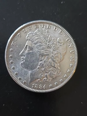 Dólar de plata Morgan 1884-P Au Morgan Foto 1 de 2