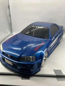 Coche de radiocontrol radiocontrolado Nikko Nissan Skyline GTR R34 escala 1:5 raro SOLO COCHE - Imagen 1 de 24
