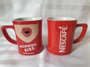 2 NESCAFE RED COFFEE MUGS / CUPS, CHEEKY MUG - Picture 1 of 3