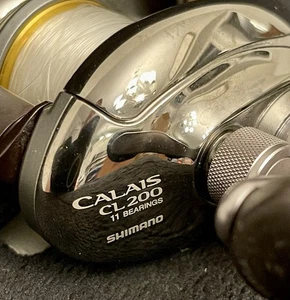 Shimano Calais CL200 Baitcastrolle Rechtshand 11 Kugellager Abdeckung EUC! - Bild 1 von 12