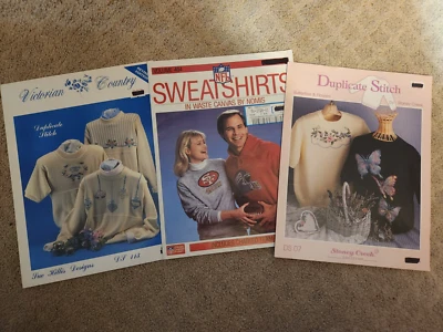 cross-stitch patterns/leaflets, lot of 3, for sweaters & sweatshirts - Image 1 of 4