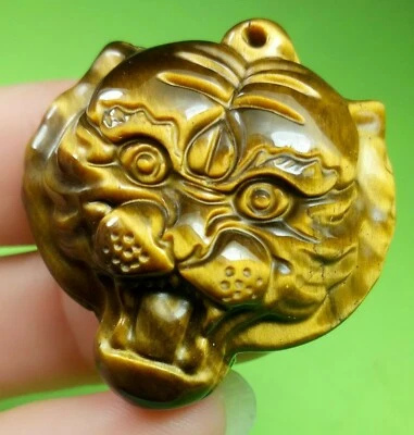 Amuleto con cabeza de tigre colgante de la suerte tallado a mano ojo de tigre amarillo natural chino  Foto 1 de 4