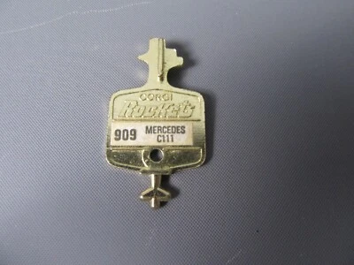 B159 Vintage 1969 Corgi Rockets 909 UK Mercedes C111 Chiave D'Oro In Metallo - Immagine 1 di 2
