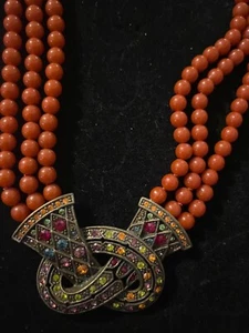 Designer Heidi Daus  Love knot  orange/rust color Crystal  Necklace - Picture 1 of 5
