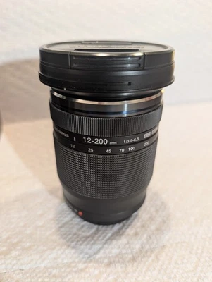 Used - Olympus M.Zuiko Digital ED 12-200mm f/3.5-6.3 Lens - Image 1 of 4