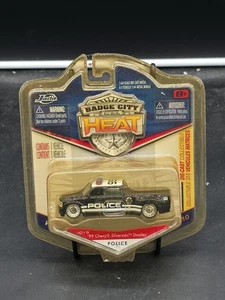 JADA Badge City Heat WAVE 2 2010 POLICE 99 Chevy silverado DOOLEY MINT ON CARD - Picture 1 of 2