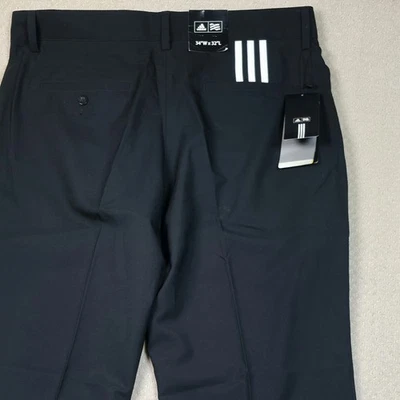 ​Nuevo con etiquetas Pantalones Adidas Golf 3 Rayas Para Hombre 34x32 Negro Climalite Elastizados Frente Plano  Foto 1 de 4