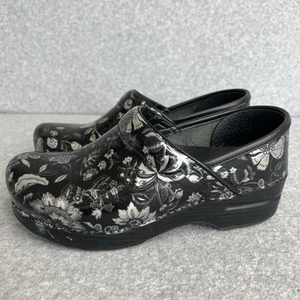 Dansko Clogs Damen 37 US 6,5-7 schwarz Blumen Pflege Lackleder LESEN! - Bild 1 von 18