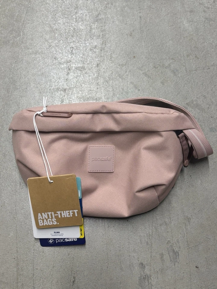 Paquete de eslinga antirrobo Pacsafe GO rosa Foto 1 de 4