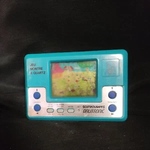 🍄 Jeu Montre à Quartz Dalitronic * Les Schtroumpfs * Jeu électronique / 1982 - Picture 1 of 8