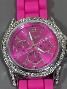 Pink Dial Crystal Accent Round Silver Tone Case Pink Silicone Band Watch