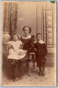 Postcard RPPC c1910s Studio Photo of Mother and Children Dressed - Picture 1 of 2