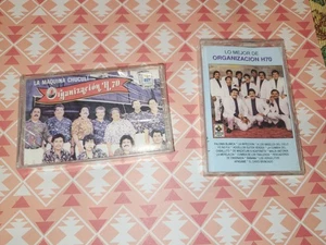 Grupo Organizacion H70 Lote De 2 Cassettes Originales Musica Latina - Picture 1 of 5