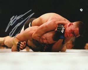 Signiertes NATE DIAZ 10"x8" UFC 196 Conor McGregor Choke Win Foto -COA- - Bild 1 von 5