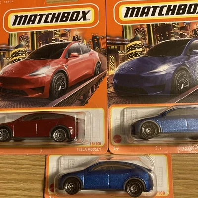 MATCHBOX 2022 #18 RED & 2024 #3 BLUE TESLA MODEL Y LOT OF 3 - Image 1 of 4