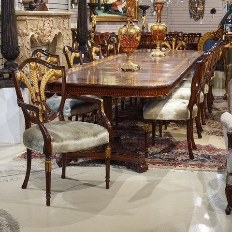 Set of 12 mahogany traditional featherback dining chairs with gold leaf details Cover
