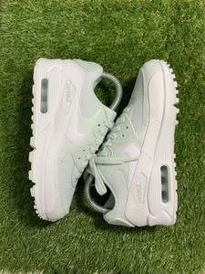 white and turquoise nike shoes