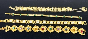 4 pulseras de muñeca tono dorado pedrería florales perros - Imagen 1 de 3