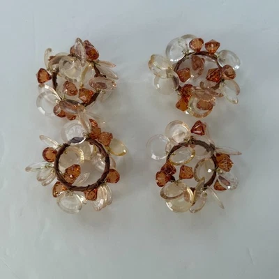 Juego de 4 servilletas decorativas con anillos de cristal ámbar y transparente Foto 1 de 3