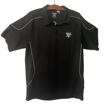 Camisa polo grande Reebok para hombre negra dorada NHL Pittsburgh Penguins Foto 1 de 4