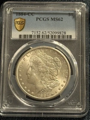 1884-CC PCGS MS 62 MORGAN SILVER DOLLAR. GOLD SHIELD, RFID.  GUARANTEED GENUINE - Image 1 of 4
