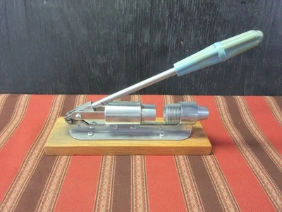 Reeds Rocket Pecan Cracker  - heavy steel  on a wooden base - Image 1 of 4