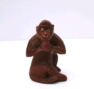 Vintage Carved Wood Monkey Eating Fruit Nut Figurine Glass Eyes 2.5 Inches - Picture 1 of 5