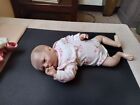 a reborn doll she is pearl she is 18 inch she comes with her ones  and sleeper.