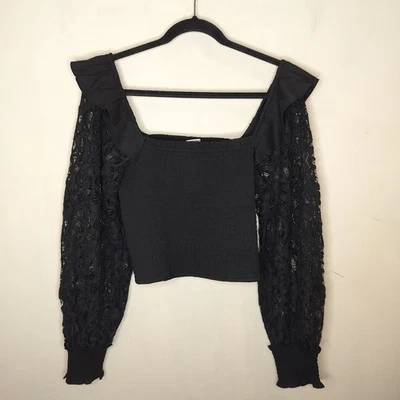 Top Express Negro Manga Encaje Calado Mujer Grande Manga Globo Volantes Foto 1 de 4