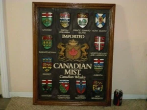 CREST EMBLEMS OF IMPORTED CANADIAN MIST WHISKY, FRAMED WOODEN WALL ART, 24"x31"  - Picture 1 of 12