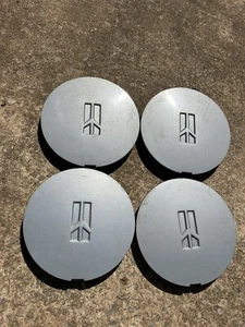 (4) 22545556 / 22547938 Oldsmobile wheel center caps Calais 03242401 - Picture 1 of 5