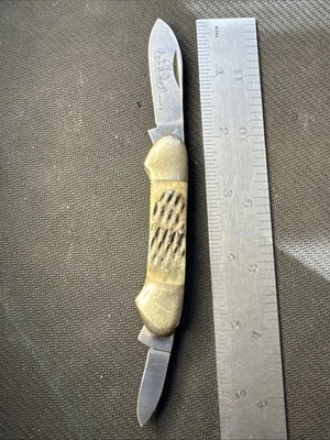 Vintage Frost Cutlery Canoe II Jigged Bone Knife With Canoe Etched Blade - Image 1 of 4