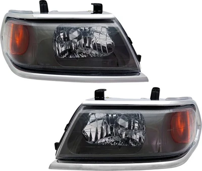 JUEGO PAR de faros delanteros con bombilla para 00-04 Montero Sport Foto 1 de 4