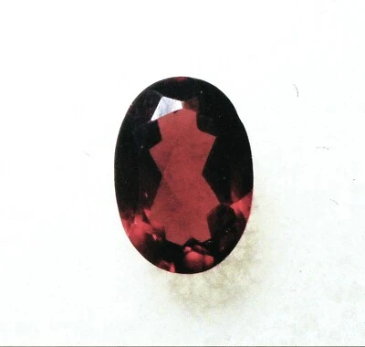 VERY NICE 7 X 5 mm FACETED OVAL CUT MOZAMBIQUE GARNET GEMSTONE - Image 1 of 2