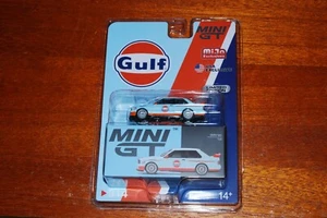 1:64 Mini GT BMW M3 E30 Gulf - LHD USA Blister Packaging MJ Exclusive - Picture 1 of 2