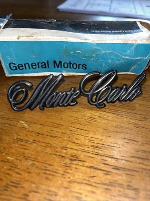 NOS 1973 1974 1975 CHEVROLET MONTE CARLO HEADER PANEL EMBLEM 6258144 GM - Image 1 of 4