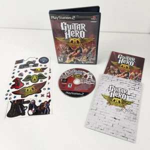 Guitar Hero Aerosmith (PlayStation 2) COMPLETE w/ manual, tour book, stickers - Bild 1 von 7