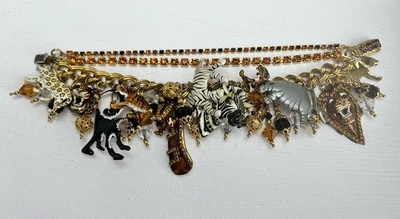 Pulsera gruesa de 3 hilos Lunch At The Ritz firmada con dije de safari en la selva Foto 1 de 4