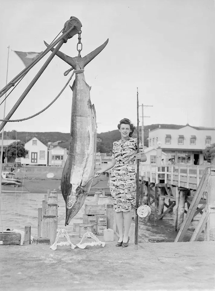 Woman posing with a captured marlin New Zealand, Photo8.5x11 - Image 1 of 1