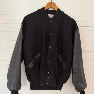 Chaqueta Universitaria DeLong Vintage Años 90 Lana Negra y Cuero Negro Mangas Medianas  Foto 1 de 4