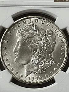 1899-O $1 Morgan dollaro d'argento BLAST WHITE NGC - Foto 1 di 3
