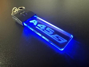 Llavero / Llavero Luz LED MERCEDES AMG A45 S - 7 Colores LED - Logo Coche - Insignia - Imagen 1 de 11
